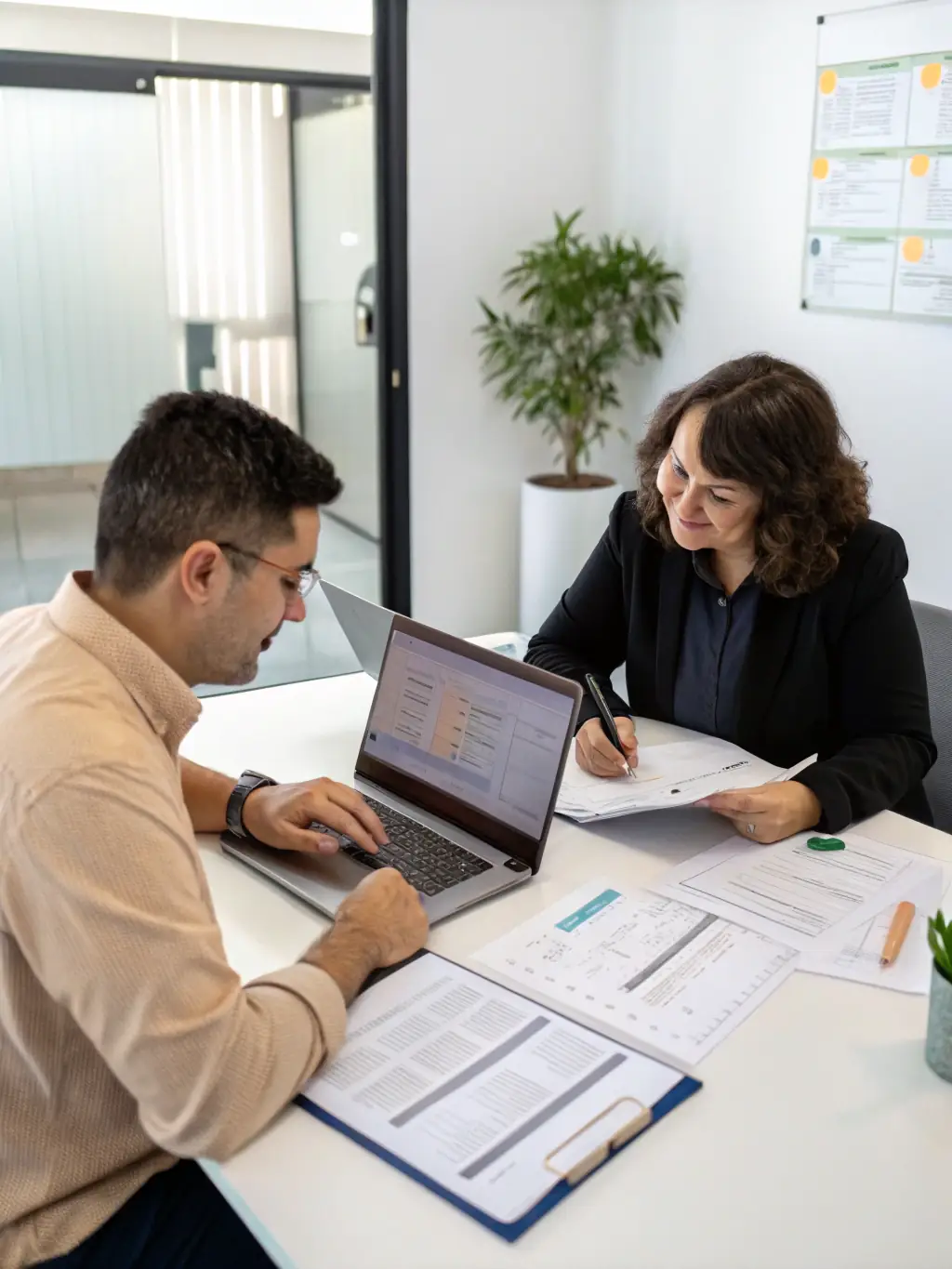 A consultant reviewing financial statements with a business owner in a modern office setting, emphasizing data-driven decision-making.